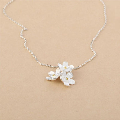 triangle forget me not necklace