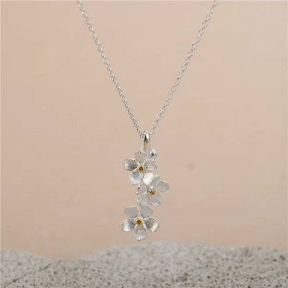 triangle forget me not necklace