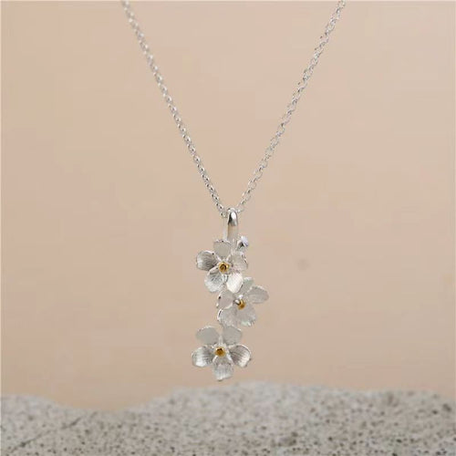 triangle forget me not necklace
